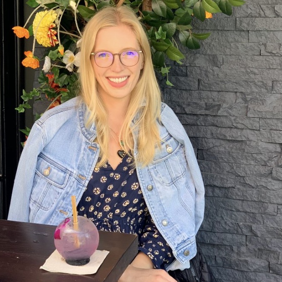 Kelsey at brunch, cocktail on the table