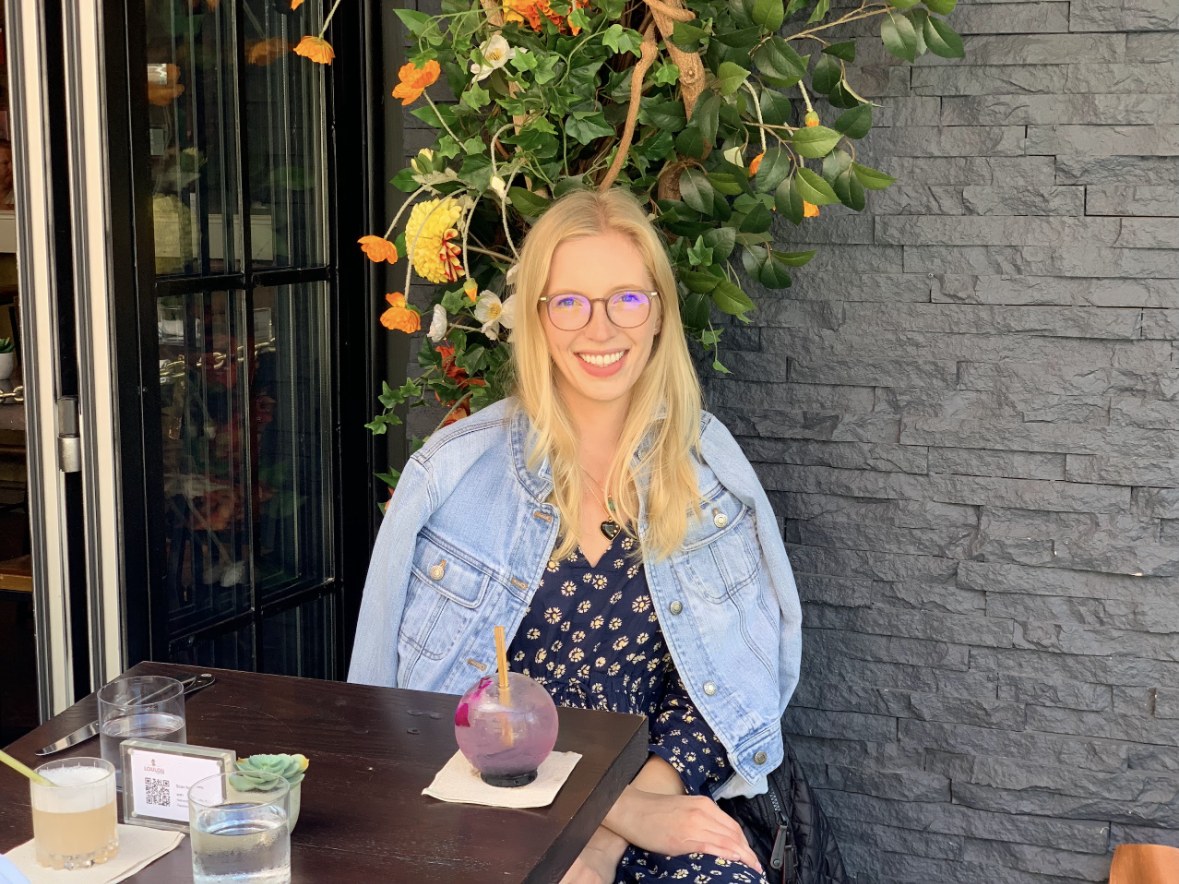 Kelsey at brunch, cocktail on the table